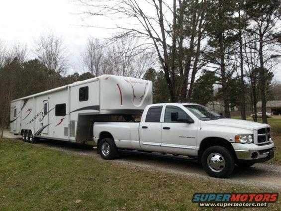 White 2003 Dodge Ram 3500 dually towing a fifth-wheel RV