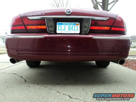 Maroon 2003 Mercury Grand Marquis rear view with Michigan license plate CLJ 8411