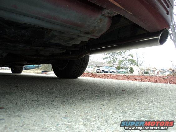 Red 2004 Mercury Grand Marquis underside view showing exhaust pipe