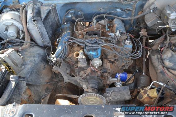 Engine bay with V8 engine and visible wiring