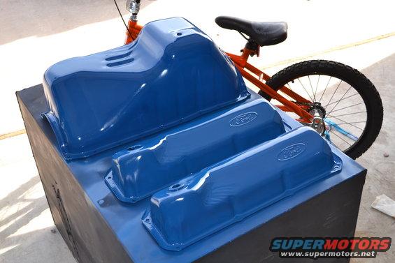 Blue Ford valve covers and oil pan with visible Ford logos