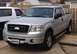 2006 Ford F-150 - Silver 2006 Ford F-150 pickup truck with a Komatsu license plate is parked outside.