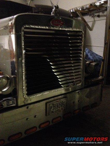 Chrome grille and bumper of a 2003 Peterbilt 379 truck with a license plate P359285