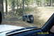 1990 Ford Bronco - A Jeep Wrangler navigates a challenging off-road trail, with another vehicle following behind.