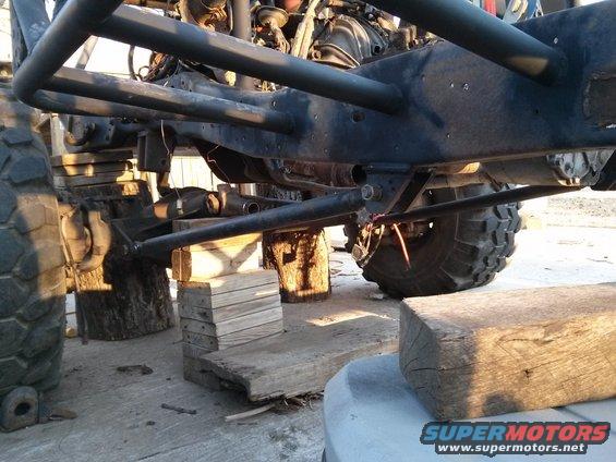 Off-road vehicle chassis on blocks, showing suspension and large tires