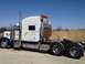 2003 Peterbilt 379 - Side view of a 2003 Peterbilt 379 semi-truck parked outdoors.