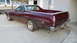 1972 Ford Ranchero - Maroon 1972 Ford Ranchero with a black vinyl top and aftermarket wheels.