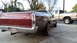 1972 Ford Ranchero - The rear of a classic Ford Ranchero is shown, with a modern pickup truck in the background.