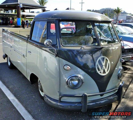 Two-tone grey and white Volkswagen Type 2 pickup truck, front 3/4 view