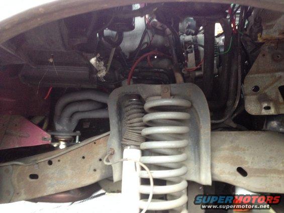 Here is the passenger side before. I got the wheel and wheelwell out in about 5 minutes. This is a muct for anyone doing headers.