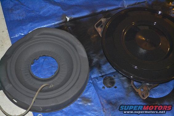 Black air cleaner assembly on blue tarp