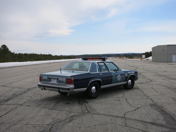 Dark blue 1991 Ford Crown Victoria police car, rear quarter view