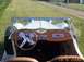 1939 Jaguar S-Type - Dashboard and steering wheel of a classic convertible, viewed from the passenger side.