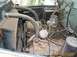 1950 Ford F-250 - Close-up view of the engine bay, showing the carburetor, fan, and radiator hoses.