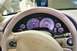 1992 Mercury Grand Marquis - The interior of a Corvette shows its dashboard, steering wheel, and gauges, with the Corvette emblem visible on the wheel.