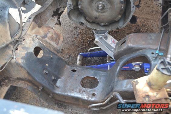 Vehicle frame with transmission and jacks supporting it