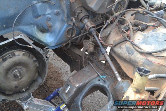 1981 Ford F-250 engine bay with transmission removed, showing steering column and wiring