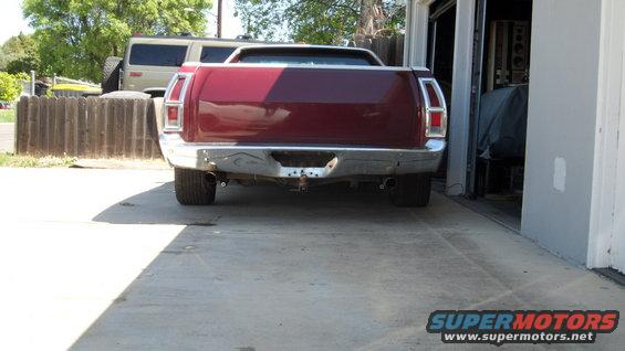 1972 Ford Ranchero rear view, maroon paint, chrome bumper, parked in driveway