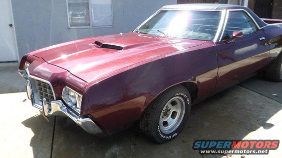 Maroon 1972 Ford Ranchero parked outside