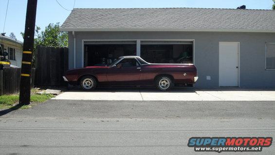 1972 Ford Ranchero parked in front of a garage