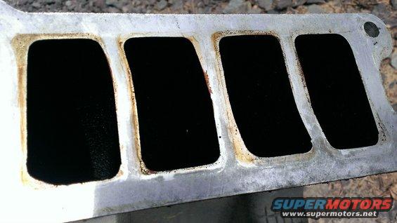 Upper intake manifold full of carbon build-up and grease.