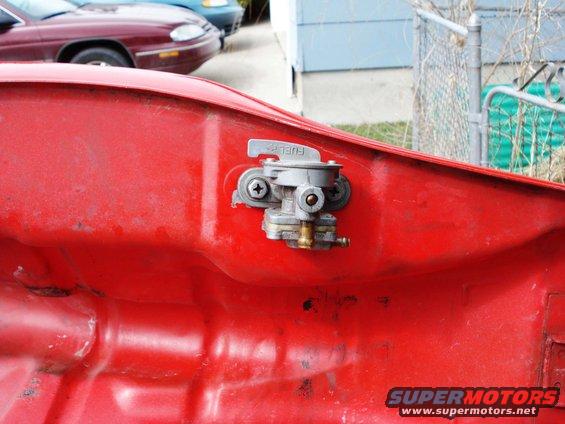 Red gas tank with fuel petcock and "FUEL" label