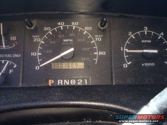 Dashboard gauges showing 300,160.9 miles and RPM