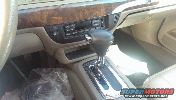 Interior view of a 2000 Mercury Grand Marquis showing the center console and gear shifter