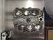 1996 Ford Probe - Engine block with six cylinders and pistons is shown on a metal surface, possibly during a rebuild.