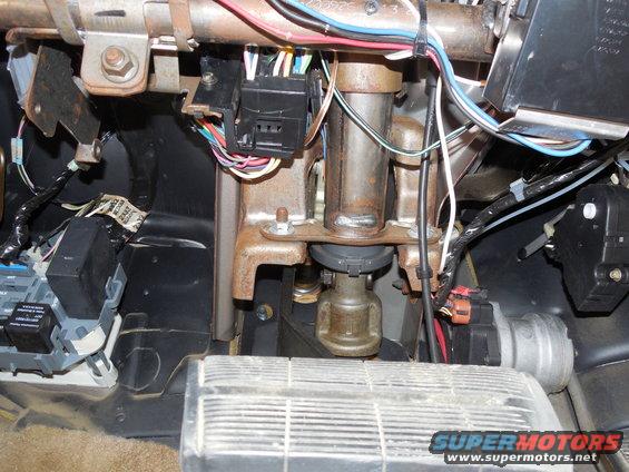 mfs03.jpg From below the dash, most of the column wiring goes to the big block just L of center at the top.  The inner 2 rows of wires are for the ignition switch, and the outer 2 are for the MFS.  The ig.sw. connector has to be unbolted & unplugged before the MFS connectors can be unclipped from it.  The whole block is clipped to a flimsy frame with a single 7mm screw holding it to the dash structure.