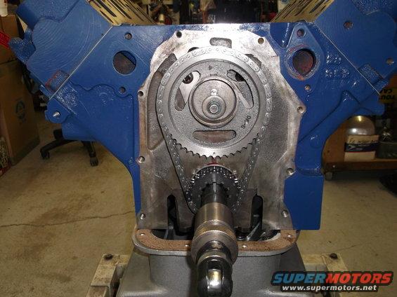 Close-up of engine block with timing chain and gears exposed
