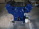 1967 Ford Mustang - A blue V8 engine assembly, including the oil pan and fuel pump, is shown from the side.