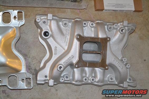 Two aluminum intake manifolds, one labeled WEIAND