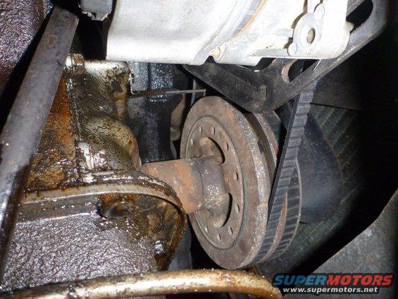 Engine pulley and belt assembly with oil leaks