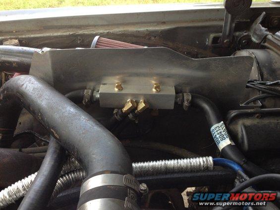 image.jpg Another shot of the manifold. You can see the hose routing better here. The fan sensors are on the bottom. I spray painted the wires: blue for low temp; red for high temp.