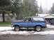 1988 Ford Bronco - A two-tone Ford Bronco is parked on a street with snow on the ground.
