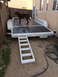 2014 Transnational Firestar 150CC - A brown dog stands on a white utility trailer with a wooden deck and an extended ramp.