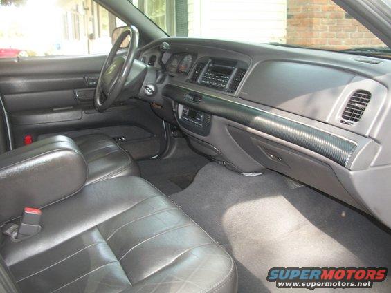 Black leather seats and dashboard of a 2003 Mercury Grand Marquis