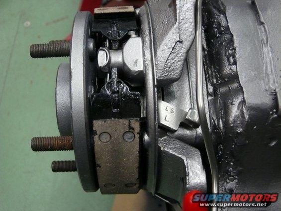 Car brake assembly with brake shoes and wheel studs