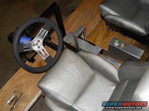 Steering wheel, shifter, and seats from a racing simulator setup