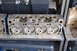 1981 Ford F-250 - A close-up view of an engine cylinder head, showing the intake and exhaust valves and ports. Some cast-in text is visible.