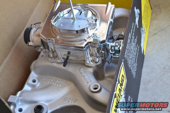 Weiand performance carburetor and intake manifold in a box. Part number 8010 is visible