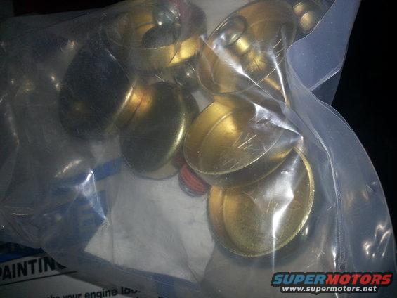 Bag of brass fittings, some with markings like 1/2