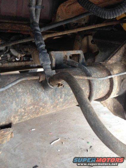 hose.jpg The hose in question is the one going towards the camera to the bottom right. It is not connected to anything and its coming from my 8.8. I have it pushed up so that its not dragging or leaking anything. Anyone have a clue what it is?