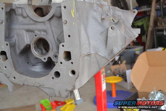 Gray engine block on red stand