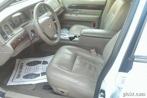 2000 Mercury Grand Marquis interior, tan leather seats, wood trim dashboard