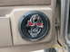 1991 Land Rover Range Rover - Close-up of a car's interior door panel showing a custom speaker with a skull design.