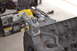 1981 Ford F-250 - Close-up of an engine block and thermostat housing, with tools and parts in the background.