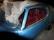 1971 Chevrolet Camaro - This 1971 Chevrolet Camaro is undergoing restoration, showing its blue exterior and red interior, partially covered in protective plastic.