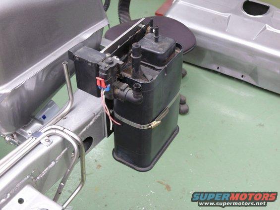 Evaporative emissions canister and fuel lines on a vehicle frame